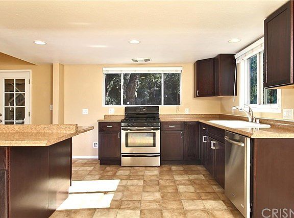Kitchen view from entry. Check out your awesome view from one of the many view windows!