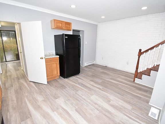 Dining room connected to laundry room with washer and dryer
