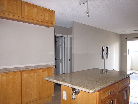 Kitchen island with stools for breakfast bar.