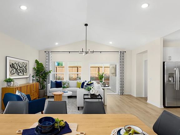 Dining area and great room with vaulted ceiling
