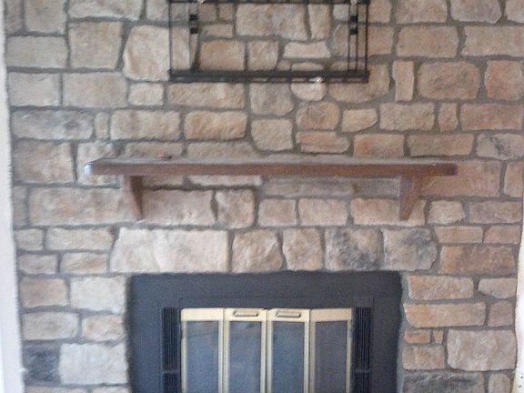 52"TV mount above fireplace.
