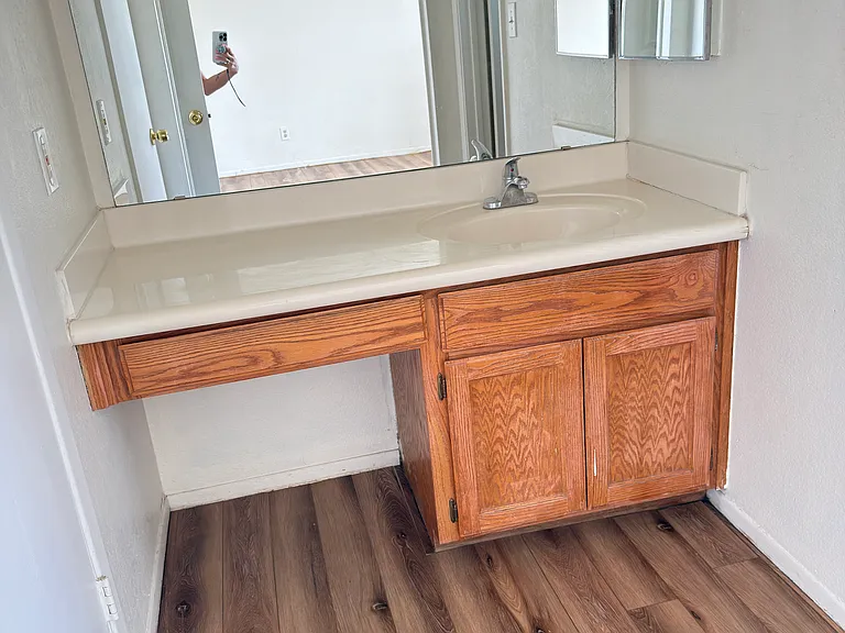 Principal bath vanity area. Does not show new paint or ceilings redone.