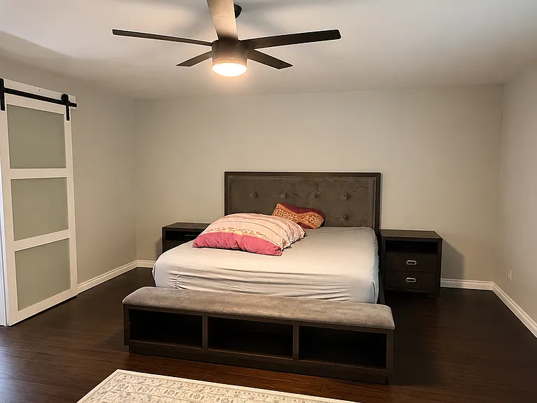 Primary bedroom with ensuite bathroom and large walk-in closet.