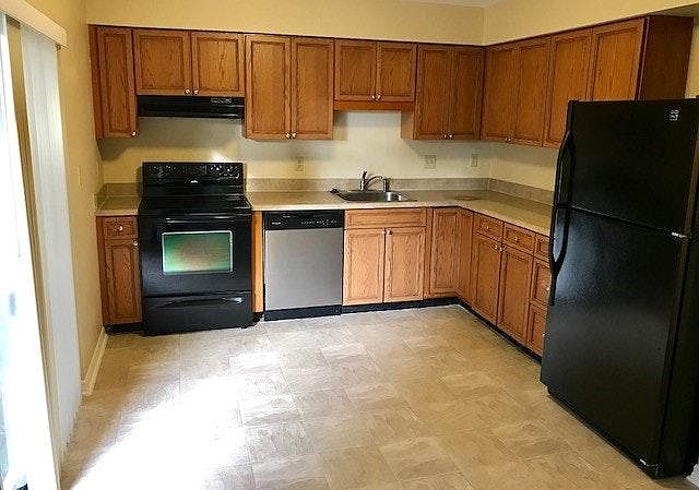 Kitchen with fenced patio