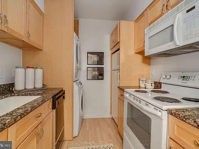 Kitchen with washer dryer.