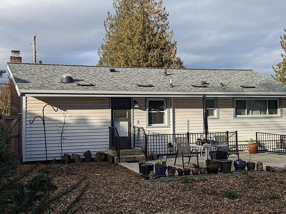Back deck with a separate entrance to basement one bedroom apartment (railing with a new staircase)