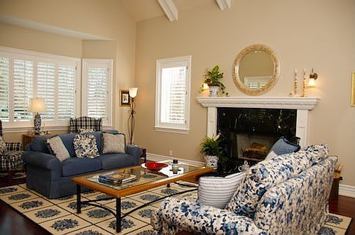 Gracious living room with fireplace and vaulted ceiling