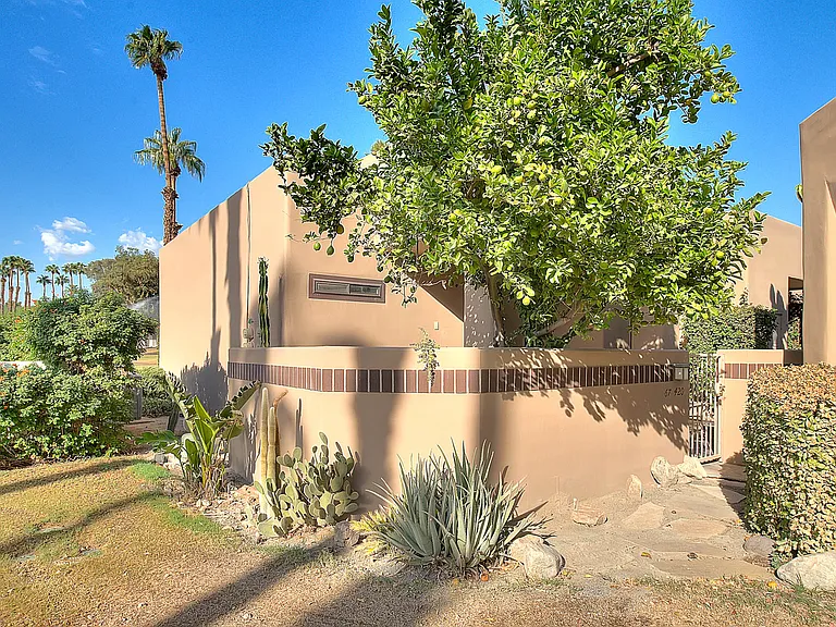 Exterior View of unit. Large lemon tree in front