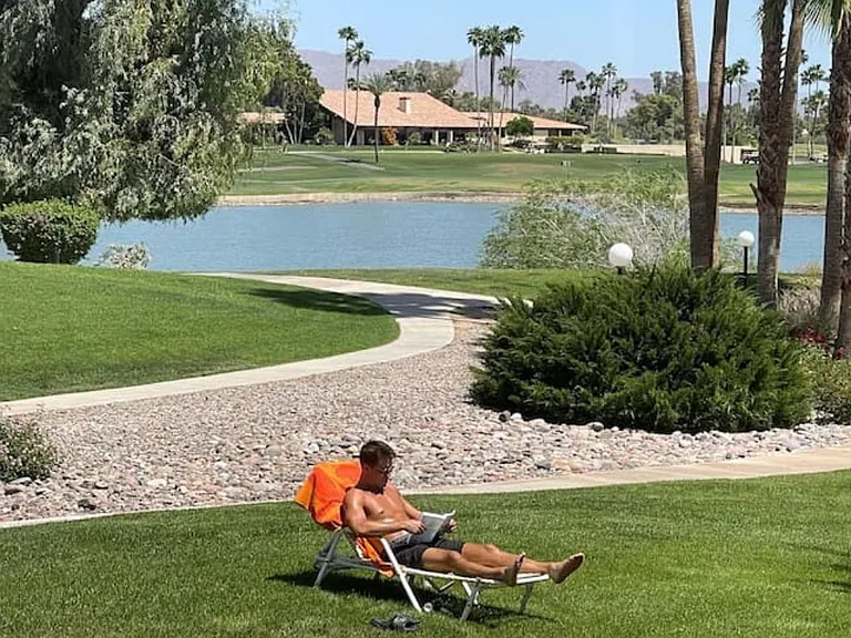 Backyard of our villa with a view over Scottsdale's largest lake, mountains, Palm Course at McCormick Ranch Golf Club, and the clubhouse serving breakfast, lunch, dinners, a championship driving range, golf academy. Perfect for reading & sun lounging