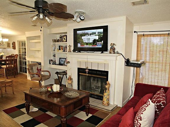 Wood Burning Fireplace, built ins in living and dining. New Light Fixtures and Ceiling Fans THROUGHOUT!