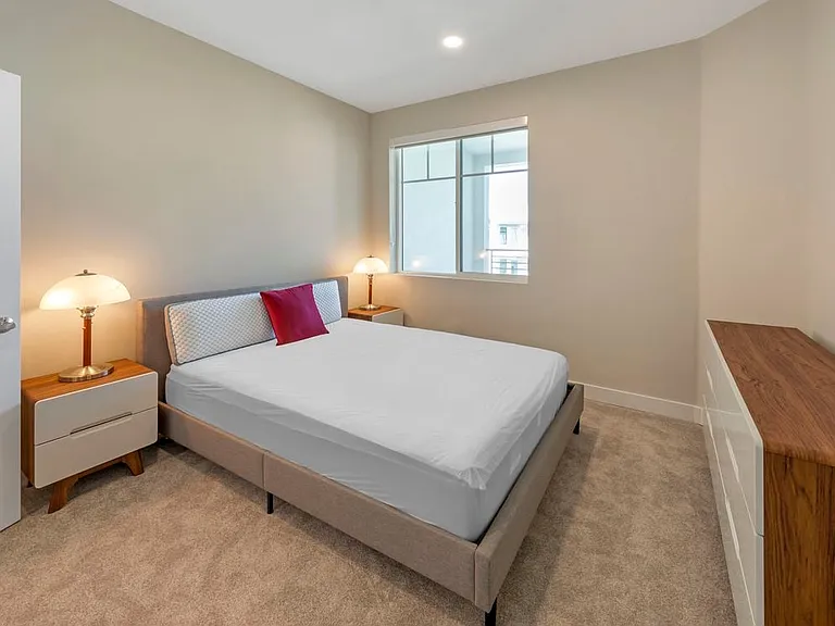 Furnished+ apartment homes feature queen bed with mattress, two pillows, dresser, nightstands, lamp, and mirror. (Representative Image exact items and style of furnishings may vary)
