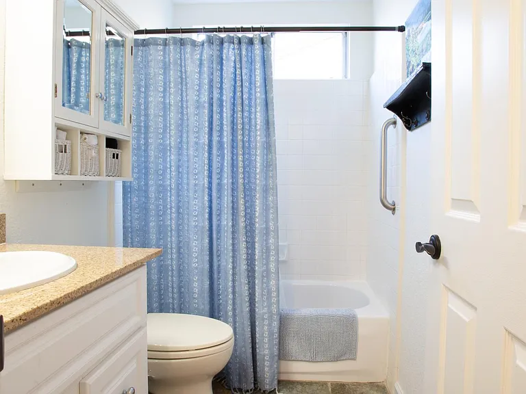 Full bathroom with bathtub.