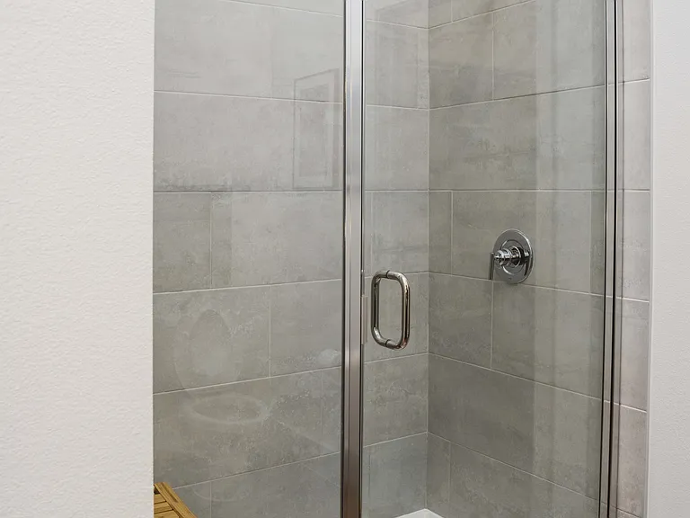 Showers with floor-to-ceiling tile surrounds