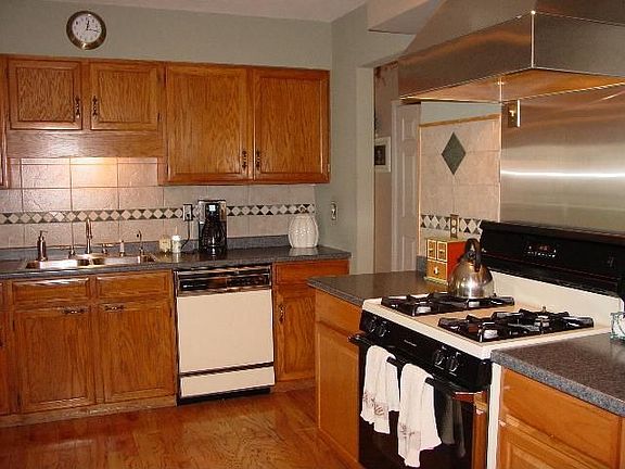Updated kitchen with hard wood floors