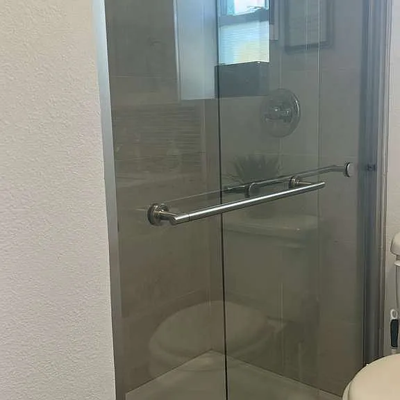 Immaculate glass shower with a cozy and modern design.