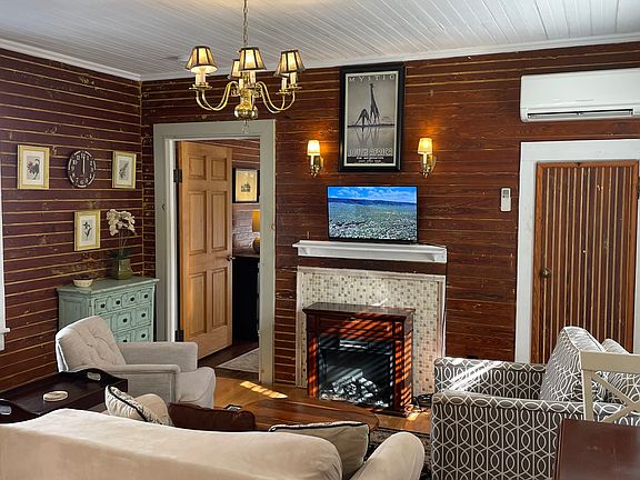 Living Room With Flat Panel Wall-Mounted Smart TV