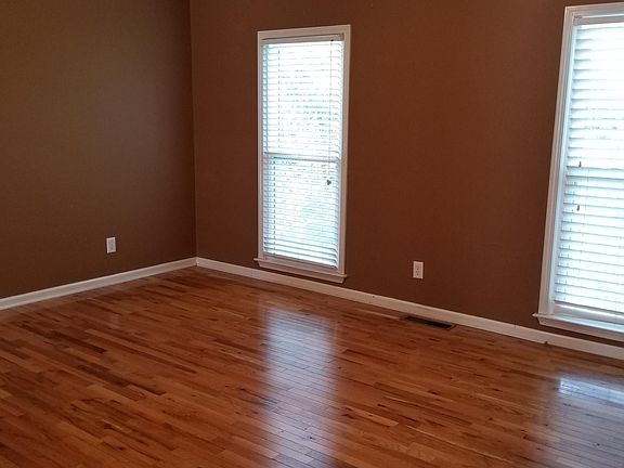 Master bedroom on main floor with hardwood floors