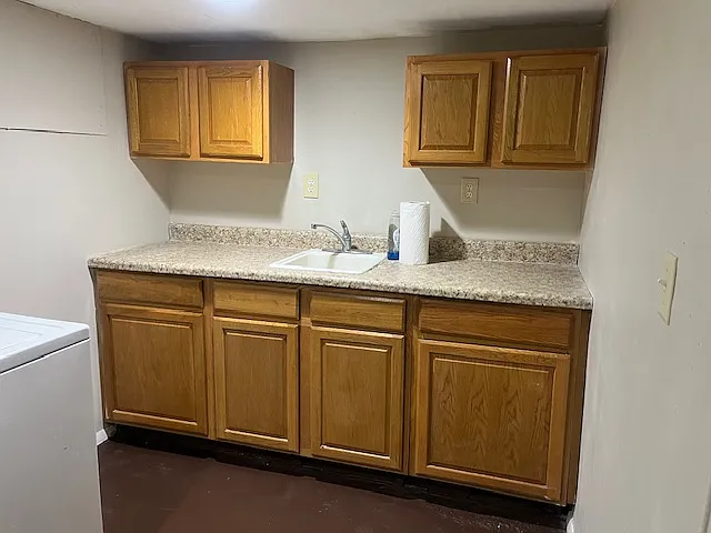 Kitchen sink and cabinets.
