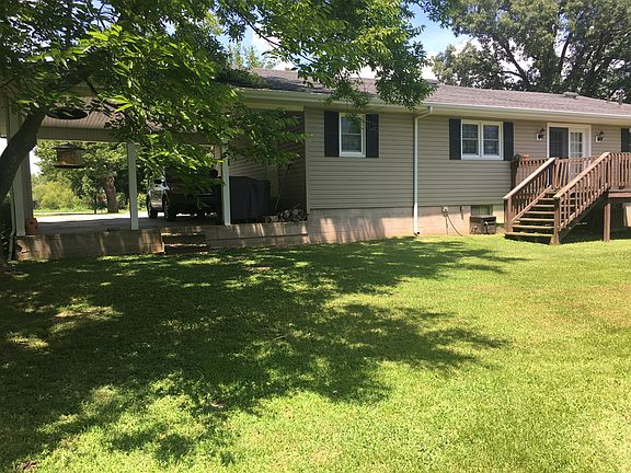 Carport, deck, back yard