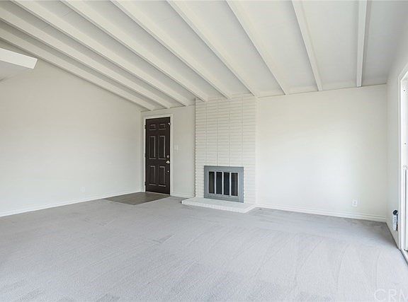 Living Room with fireplace and slider to back yard