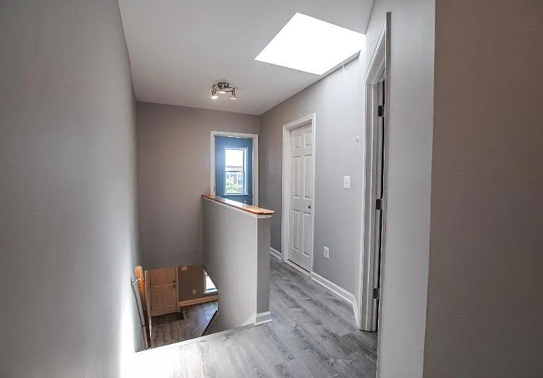 Head upstairs to find 2 bedrooms, a den, and bathroom