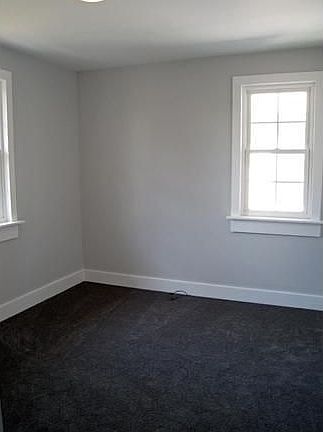 One of the spacious bedrooms with plenty of light