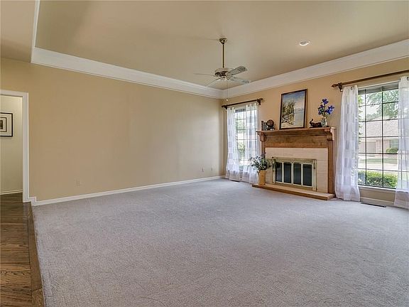 This living room is a wonderful size for entertaining.  It has been freshly painted and new carpets.