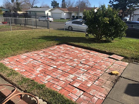 front yard with brick 10x10 brick pad for summer picnics
