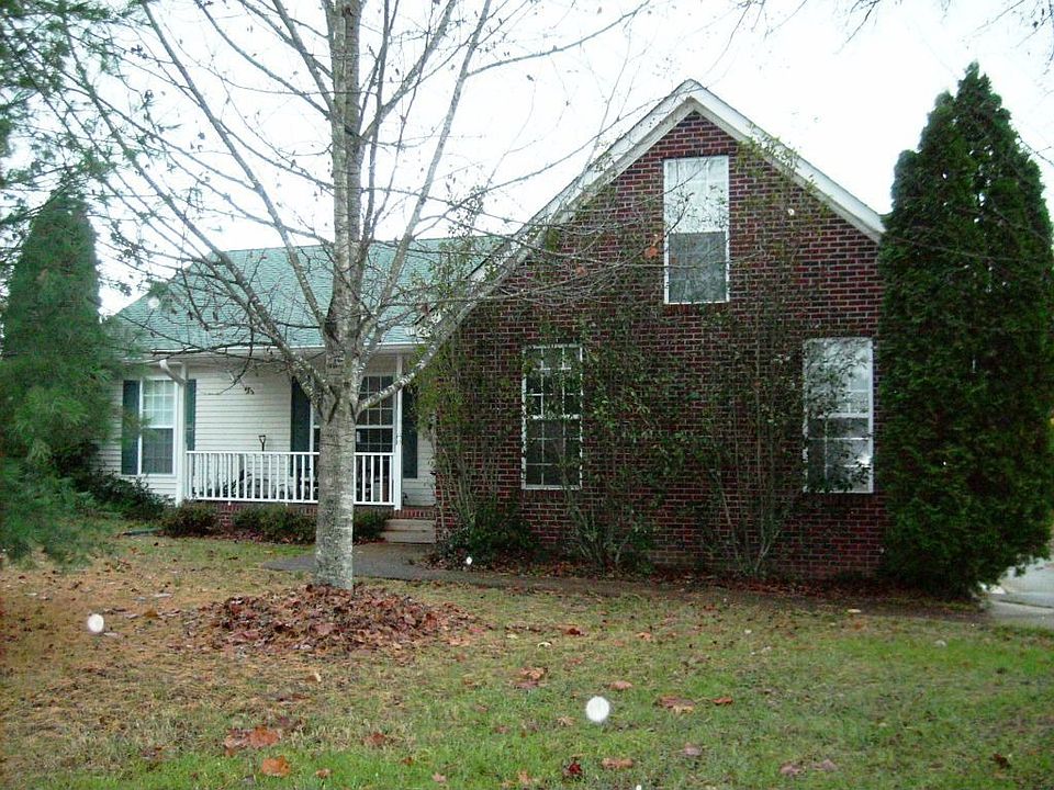 HOUSE IS SHADED BY TREES