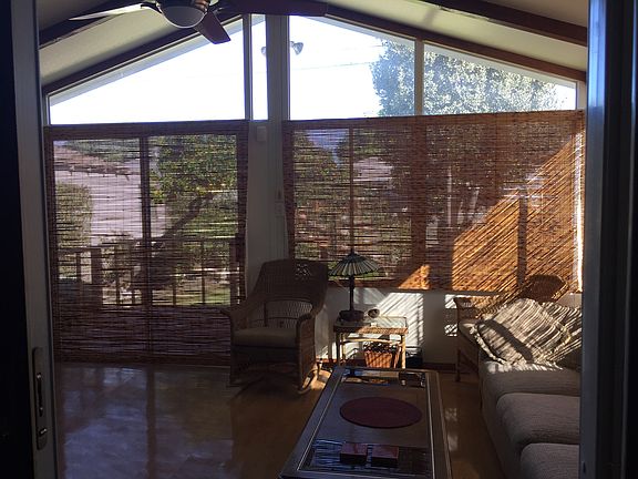 Sunroom (with shades drawn), opens on to rear deck