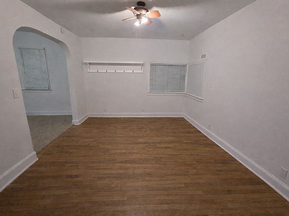 dining room with kitchen entrance to left