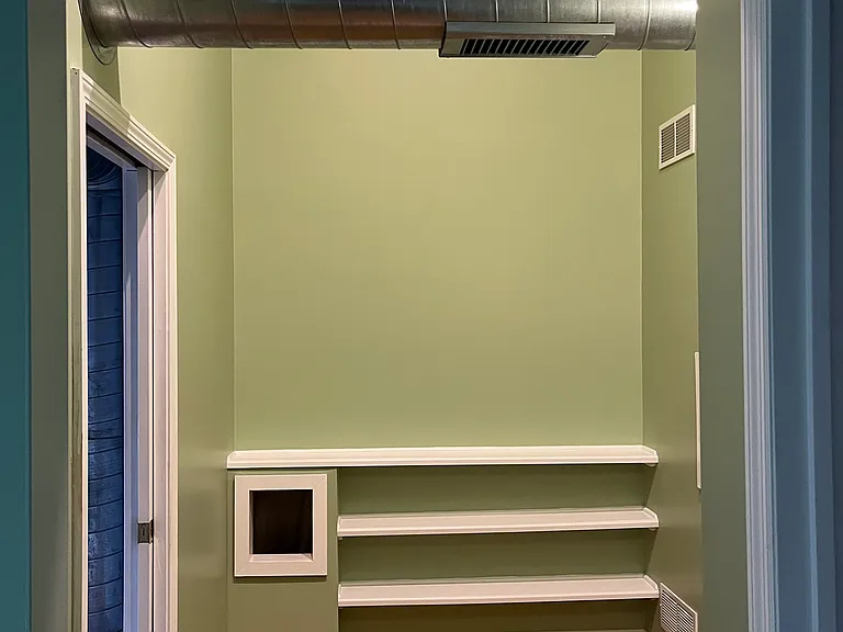 Hallway with shelves & laundry chute