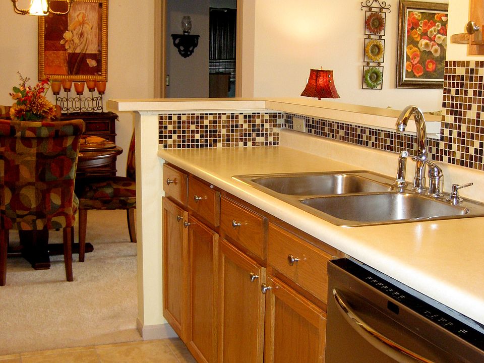Handsome backsplash through kitchen. Ceramic floors in adjacent laundry.