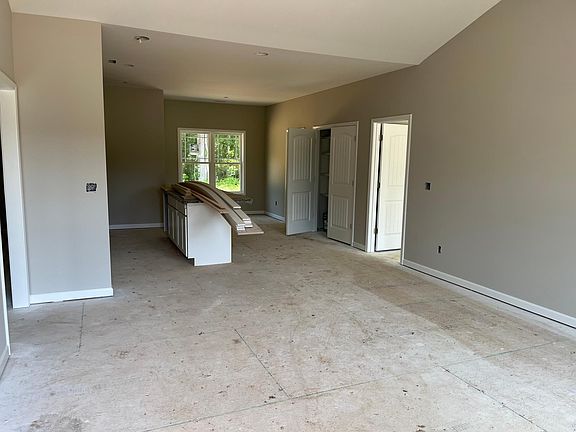 Open floor plan with cathedral ceiling in the living room.