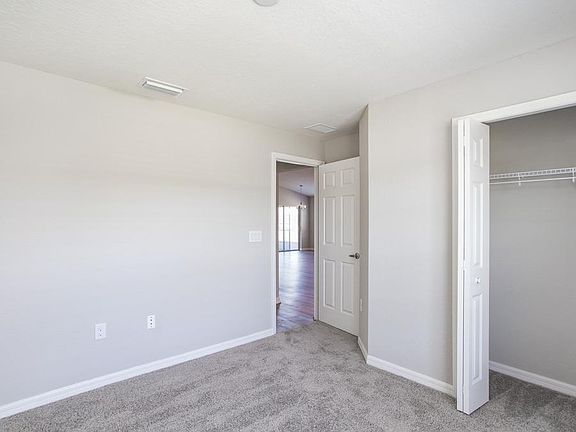 Spacious second bedroom or home office - New home for sale in Lake Alfred, FL - Photo showcases the