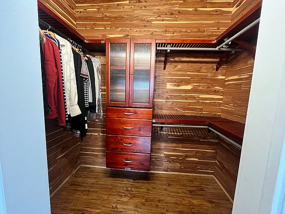 Walk-in, cedar closet with built-ins.