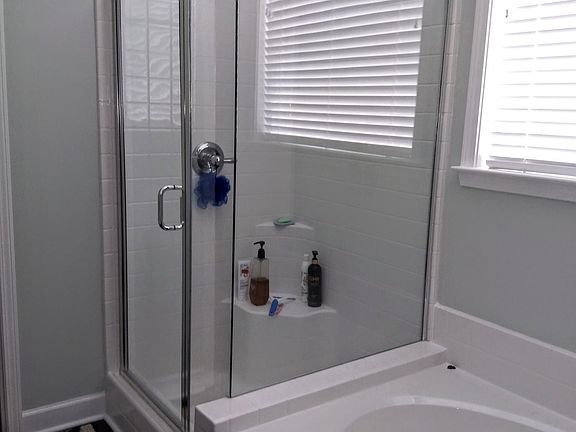 Master bath with shower and soaking tub.
