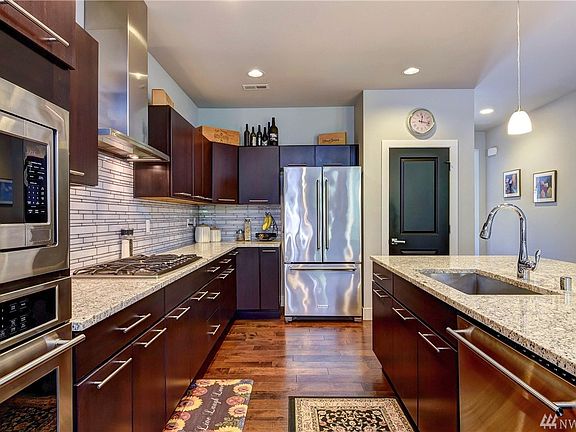 Upgraded chef's kitchen with GE Monogram appliances is loaded with storage and counter space