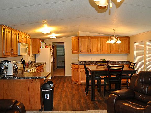 Kitchen and Dining with Lots of Cabinets and Newly Installed Countertops.