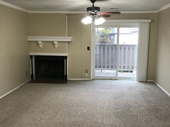Living room with wood-burning fireplace