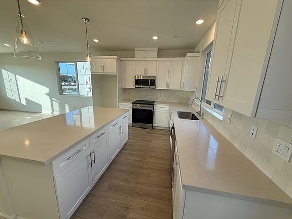 Large kitchen island with quartz countertop