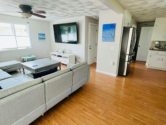 The living room is directly off the kitchen and first floor bathroom.