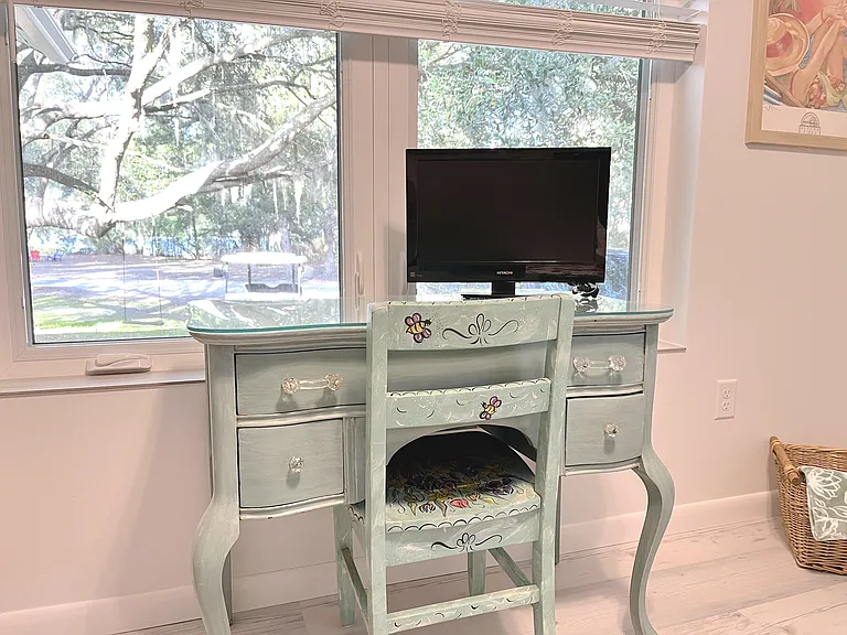 Need desk space? This desk with monitor can serve as either make-up dresser or some work away from the office. An office chair can be provided. Printing service available.