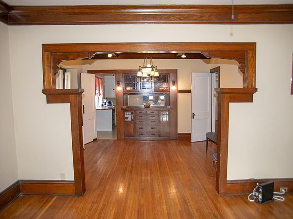 Living room view of dining room with custom built-in.
