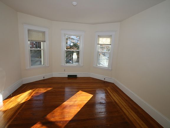 Living room, bay windows sunny!