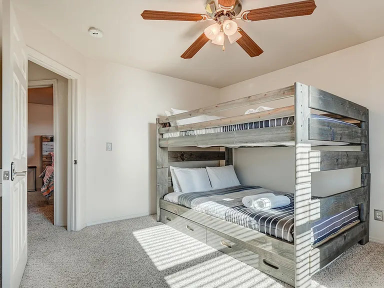 Full over full bunk bed with a twin sized trundle bed