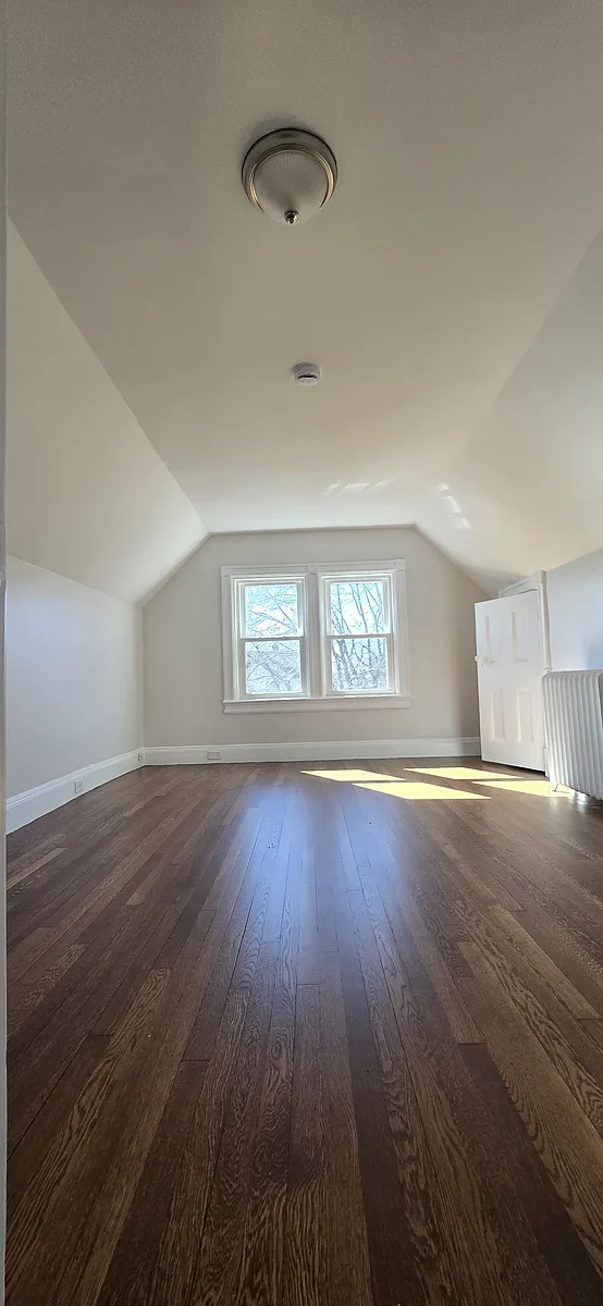 Bedroom with wooden floors and 2 closets. - 19 Primrose Ave #3