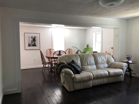 Living-dining room. End seats on sofa recline.