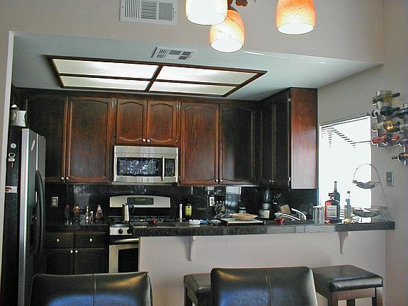 Upgraded  kitchen w/granite counters, cabinetry & appliances. 