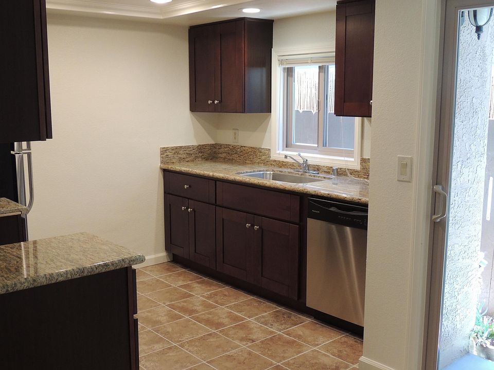 Kitchen with window facing south to small patio area.